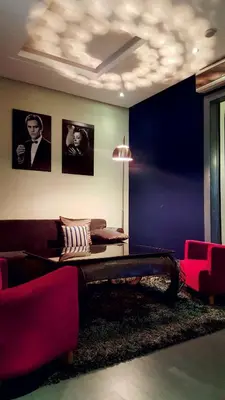 a living room with a couch and a table at Le Sphinx Boutique Hôtel in Mohammedia