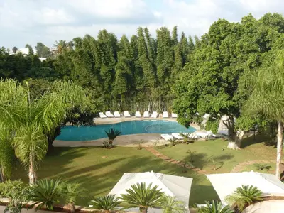 an overhead view of a swimming pool in a garden at Le Sphinx Boutique Hôtel in Mohammedia