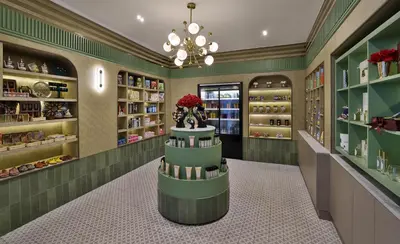 a shop with green walls and a chandelier at DoubleTree By Hilton Casablanca City Centre in Casablanca