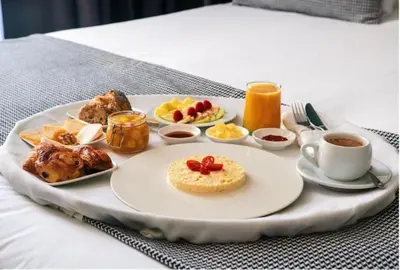 a tray of food on a table with a plate of food at Boutique Hotel Gauthier Restaurant Terrasse in Casablanca