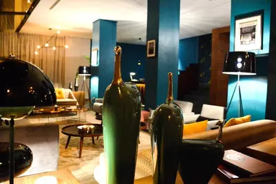 two green vases sitting on a table in a living room at Boutique Hotel Gauthier Restaurant Terrasse in Casablanca