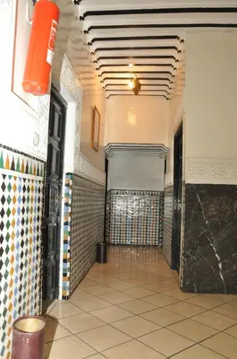 a hallway of a building with a tile floor at Hotel Boustane in Casablanca