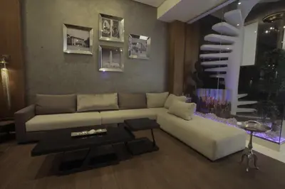 a living room with a couch and a table at The Seven Hotel in Casablanca