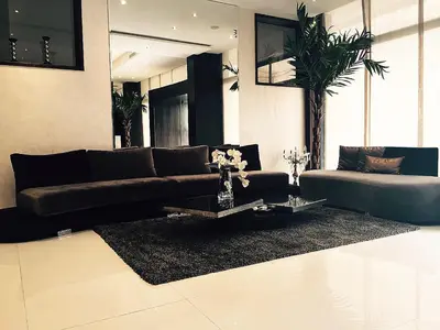 a living room with a couch and a table at The Seven Hotel in Casablanca