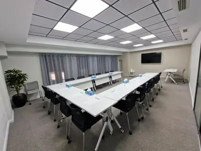 a large conference room with a long table and chairs at Melliber Appart Hotel in Casablanca