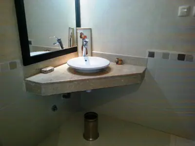 a bathroom with a sink and a mirror at Perle de Tamaris in Dar Bouazza