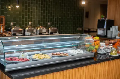 a display case with many different types of food at DownTown Hotel Maârif Casablanca By TSA in Casablanca