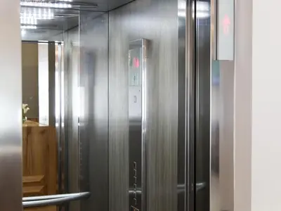 a stainless steel elevator in a room at Smarts Hotel Agdal Rabat in Rabat