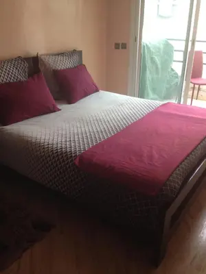 a large bed with red pillows on top of it at Casablanca centre ville in Casablanca