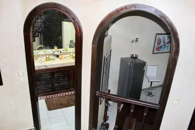 a bathroom with a sink and a mirror at Aux Moules de Harhoura Rabat in El Harhoura