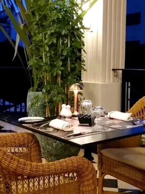 a table with chairs and a table with a tableablish at Le Casablanca Hotel in Casablanca