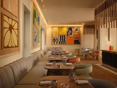 a row of tables in a restaurant with tables and chairs at The View Rabat in Rabat