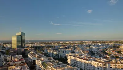 an aerial view of a city with a tall building at The View Rabat in Rabat