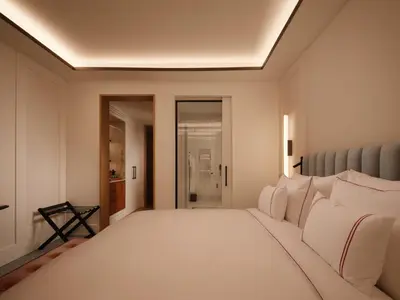 a bedroom with a large bed with white sheets at The View Rabat in Rabat