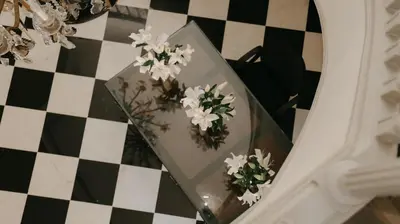 a vase with flowers on top of a table at Villa Soraya Lodge & Spa in Rabat