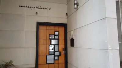 a door to a building with a sign on it at Cozy Studio in Casablanca , 1 km from Casavoyageurs station , Free parking in Casablanca
