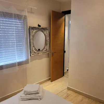a room with a mirror and a table with towels at Cozy Studio in Casablanca , 1 km from Casavoyageurs station , Free parking in Casablanca