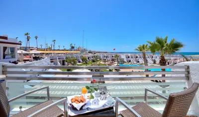 a table with a tray of food on top of a balcony at Casablanca Le Lido Thalasso & Spa (ex Riad Salam) in Casablanca