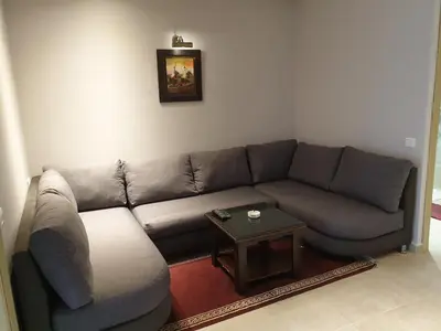 a living room with a couch and a table at Residence Davos Rabat in Rabat