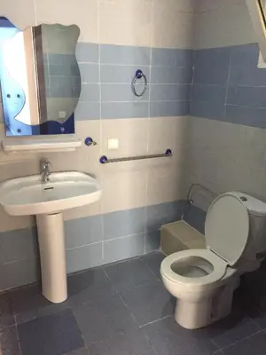 a bathroom with a toilet and a sink at Agdal Two-Bedroom Apartment 2 Minutes from Agdal Train Station in Rabat