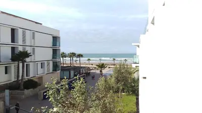 a view of the beach from the balcony of a building at Anfa Place in Casablanca