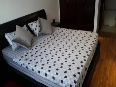 a bed with pillows on it in a bedroom at Horizon Home in Casablanca