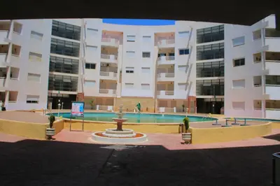 a large building with a fountain in front of a building at Jnane Eddalya in Bouznika
