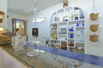 a room with a counter with glass items on it at Riad Des Plages in Bouznika
