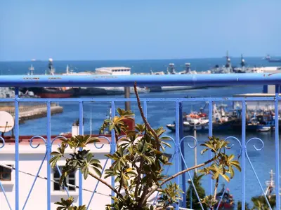 a view of a harbor with boats in the water at Hôtel Central in Casablanca