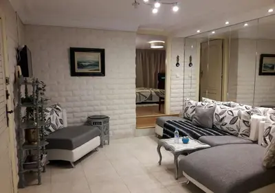 a living room with a couch and a table at Studio les Belles Residences in Casablanca