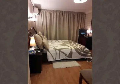 a bedroom with a bed and a table with a lamp at Studio les Belles Residences in Casablanca