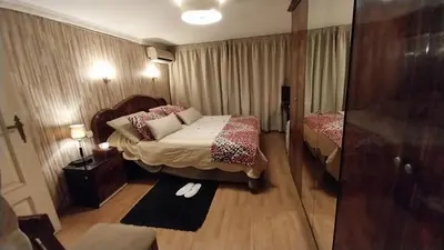 a hotel room with a bed and a mirror at Studio les Belles Residences in Casablanca