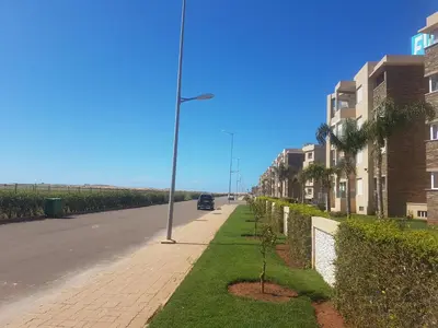 a street with a light pole on the side of a road at Evasion Bouznika أمام شاطىء بوزنيقة in Bouznika