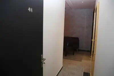 an open door to a room with a piano at Point du Jour in Casablanca
