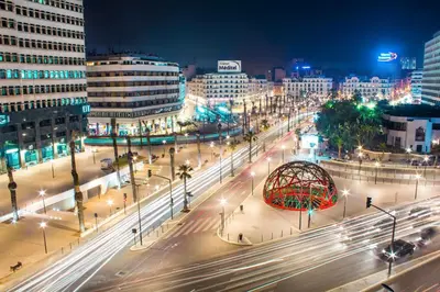 a busy city street at night with traffic at Herb studio in Casablanca (800 m from Casavoyageurs station) in Casablanca