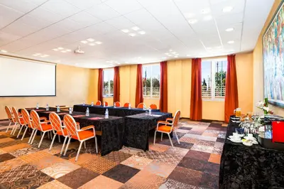 a conference room with a long table and chairs at Relax Hotel Airport Nouasseur in Nouaseur