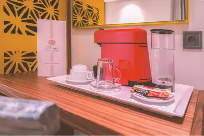 a counter with a coffee maker and a blender on it at Oum Palace Hotel & Spa in Casablanca