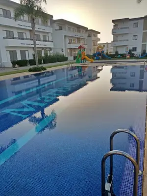 a swimming pool at a apartment complex at Marbella Beach Residency in Mansouria