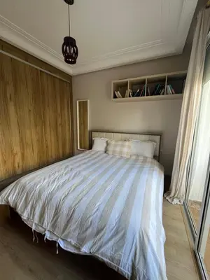 a bedroom with a large bed in a room at Appartement Casablanca Garden Beach in Casablanca