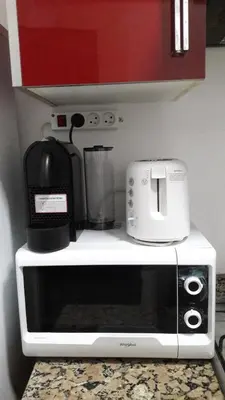 a microwave sitting on top of a kitchen counter at Horizon Garden Home in Casablanca