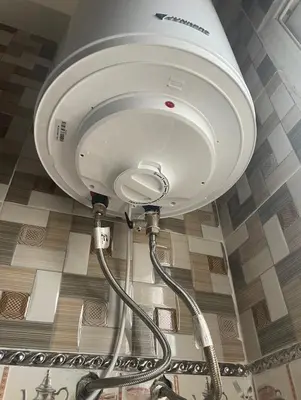 a light hanging from a ceiling with a hose at Appartement in Casablanca close to the beach in Casablanca