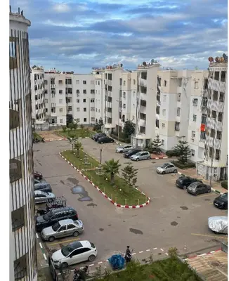 a parking lot with parked cars in a city at Appartement in Casablanca close to the beach in Casablanca