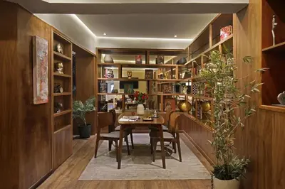 a dining room with a table and shelves at Park Suites Hotel Luxury Boutique Hotel in Casablanca