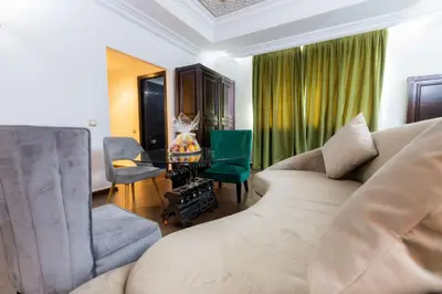 a living room with a couch and a chair at Prince de Paris in Casablanca
