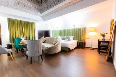 a living room with a bed and a table at Prince de Paris in Casablanca