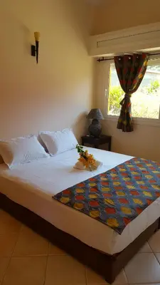 a large bed in a bedroom with a window at L'échappée belle Benslimane in O Ben Slimane