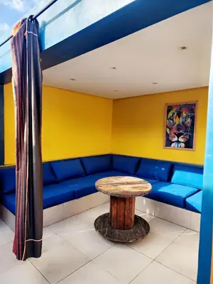 a blue couch with a table in a room at Casablanca Home Stay Apartment in Casablanca