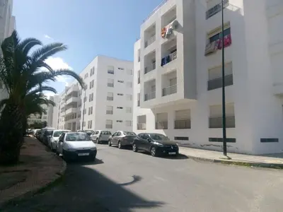 a row of cars parked in front of a building at Appartement Hay Riad in Rabat