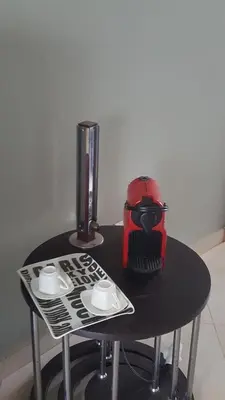 a table with a red helmet on top of it at Residence les Pins in Rabat