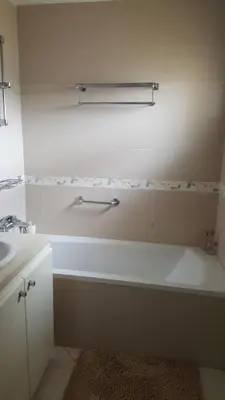 a bathroom with a bath tub and a sink at Residence les Pins in Rabat